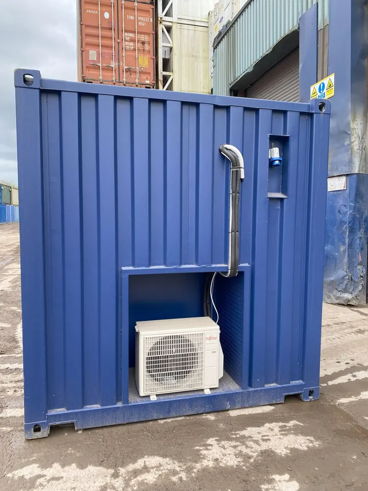 Blue 20ft battery storage container with the air-conditioning unit recessed into the end wall and an external power inlet